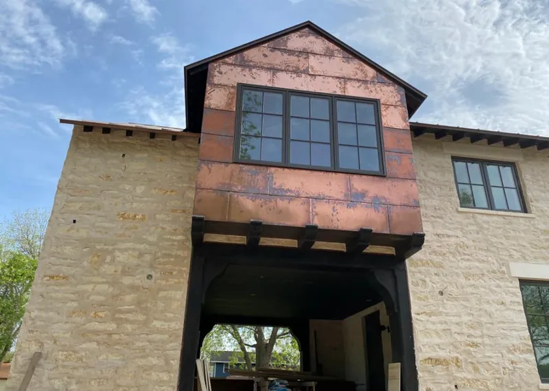 Copper metal panel facade on a stone building for Metal Roof Coating in Warrenton